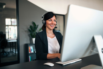 Female customer service representative using headset.