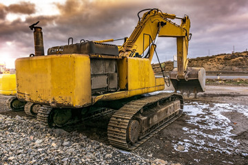 Heavy machinery in a hard day of work in the construction of a road