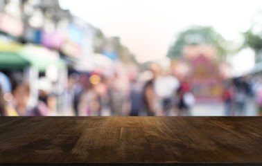 Empty dark wooden table in front of abstract blurred bokeh background of restaurant . can be used for display or montage your products.Mock up for space.