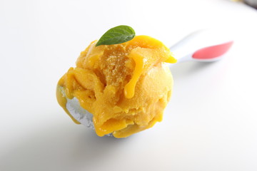 sorbet mango yellow ice cream spoon