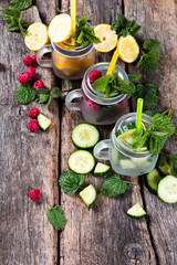 Mohito lime drinks on wood. Fresh drinks with fruits on wood. Summer concept.