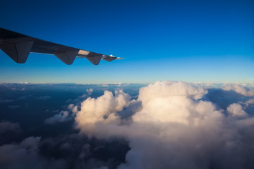 Clouds and sky with wing of airplane