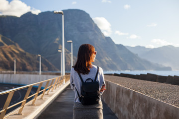 Young traveler woman enjoy the ocean walking on embankment