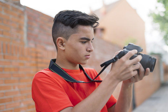 Portrait of young man taking a picture