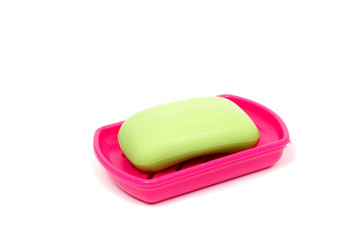 Soap in soap dish isolated on a white background. Flat lay top view