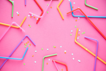 Drinking straws on pink
