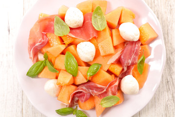 melon salad with ham, mozzarella and basil