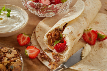 Tasty summer dessert with strawberries and cream