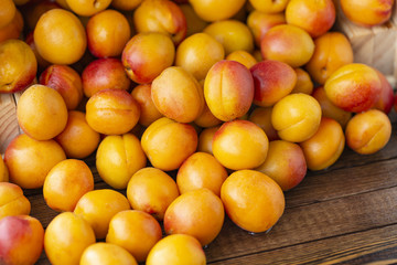 Apricots on the old wooden table.
