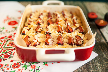Homemade fruit pie with plums and almonds