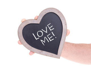 Adult holding heart shaped chalkboard