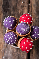Ice cream, Berries ice cream scoop in ice cream cone on wooden table. 