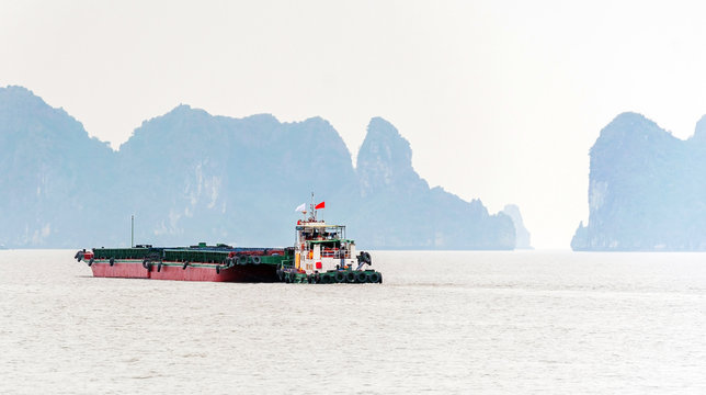 Cargo barge in the bay Halong, Vietnam. Copy space for text.