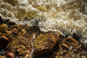 Soft wave of the blue sea on a sandy beach.