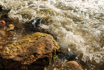 Soft wave of the blue sea on a sandy beach.