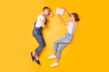 Fototapeta na wymiar Story telling interesting discussing college concept. Above full length size high-angel legs photo of clever smart excited joyful guys chilling out resting relaxing isolated bright vivid background