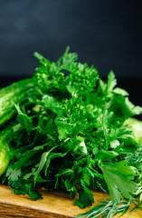 fresh herbs before cooking dark background