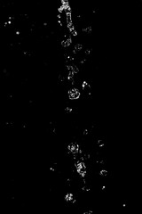 Obraz na płótnie Canvas water jet with spray on a black background