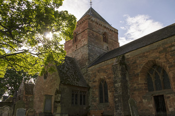 Fototapeta premium Church with Light Shining through a Tree