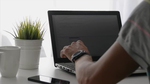 freelance programmer working on laptop