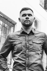 portrait of a Young man in a shirt and trousers