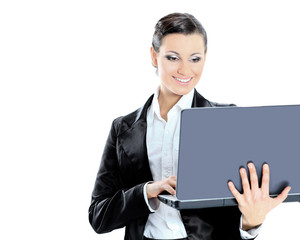 Beautiful businesswoman keeps the laptop.