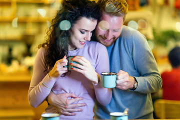 Romantic couple having date in coffee shop
