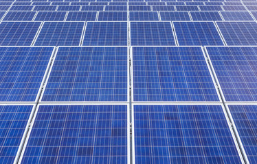 Close up rows array of polycrystalline silicon solar cells or photovoltaics in solar power plant 