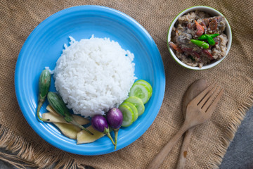 Soft cooked rice served with stew crab