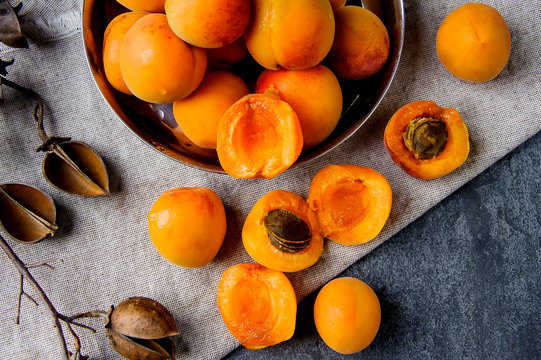 Apricots in a metal pial are stacked