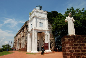 Exterior of St. Paul's Church  with St. Francis Xavier statue, Melaka city, Malaysia - obrazy, fototapety, plakaty