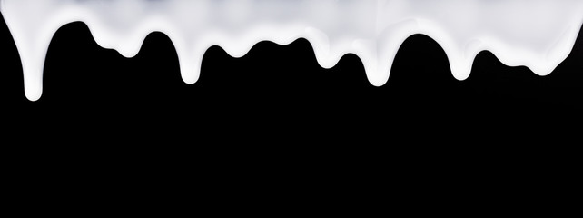 White liquid flows down the black background.