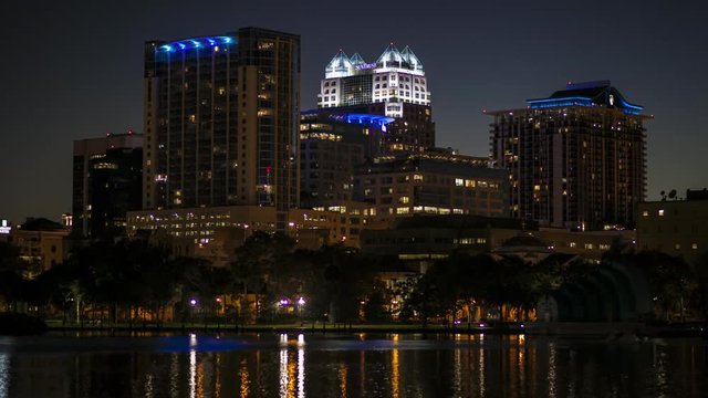 Orlando Downtown Lake Eola buildings reflection at night.