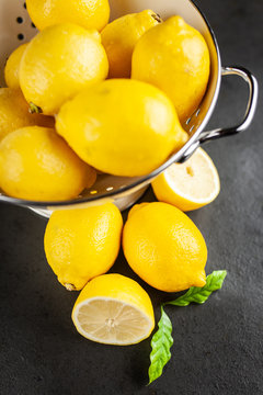 Fresh lemons with green leaves