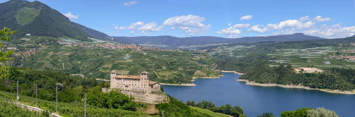 Fototapeta na wymiar View at Cles Castle and lake of Santa Giustina