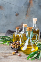 Fototapeta na wymiar Assortment of fresh organic extra virgin olive oil in bottles