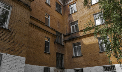 Old residential building. Apartment block. Kazakhstan (Ust-Kamenogorsk). Corner. Old architecture. Apartment building. Architectural background