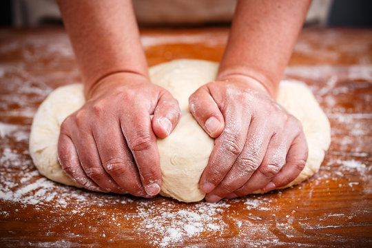 Female hands preparing dough