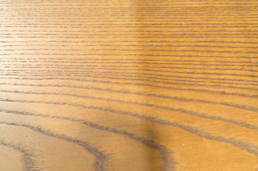 Brown wooden background with strange horizontal pattern