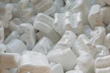 Fototapeta na wymiar Polystyrene or white styrofoam packing for protection of damage to fragile objects during shipping