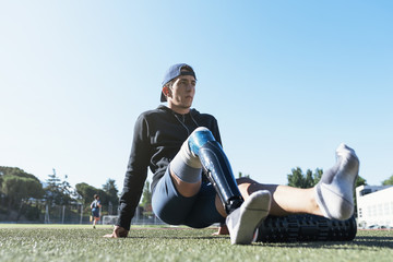 Portrait of disabled man athlete with leg prosthesis.