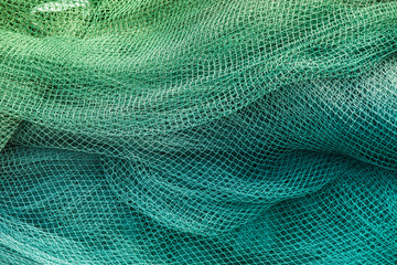 Blue and green fishing nets - obrazy, fototapety, plakaty