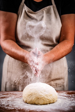 Woman sprinkling flour