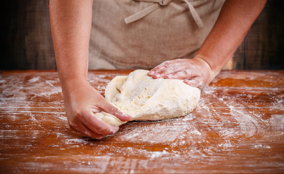 Female hands preparing dough