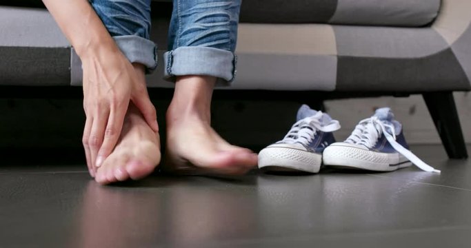 Woman feeling pain on her toe