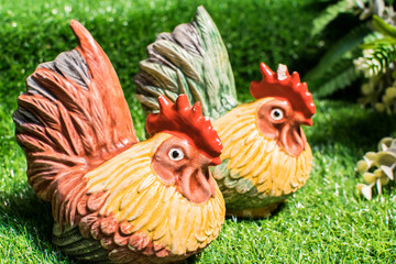 Chicken statue on the lawn.