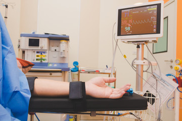 Patient's hand Preparing for surgery in the operating room