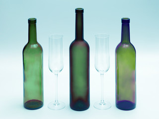 empty bottles and wine glasses on a white background