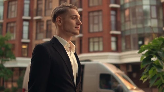 Model looking man goes home after working day. Guywalking in city