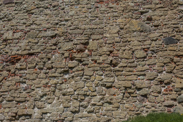 the wall of an old building lined with stones
